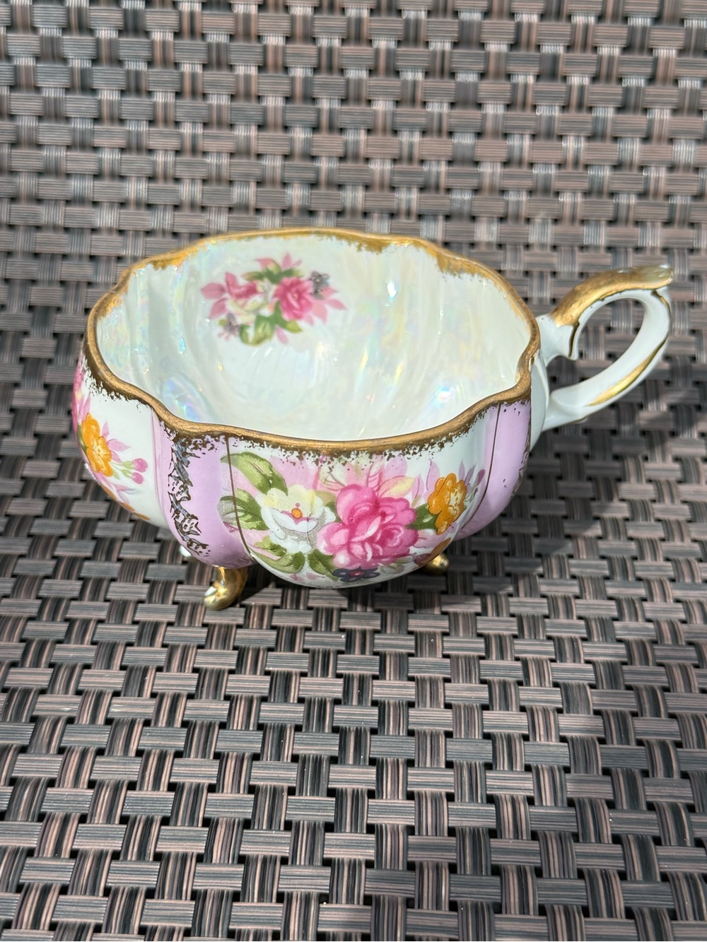 vintage porcelain teacup pink and gold floral design iridescent finish  feet.